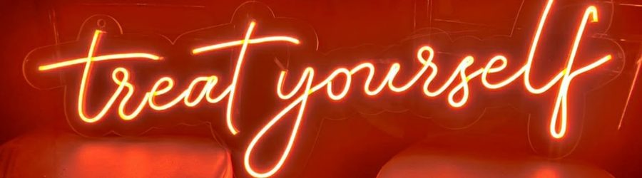 Treat Yourself neon sign